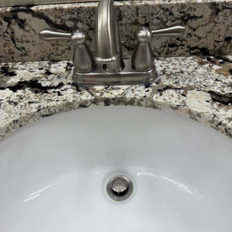 Master bathroom faucet with granite countertop and sink