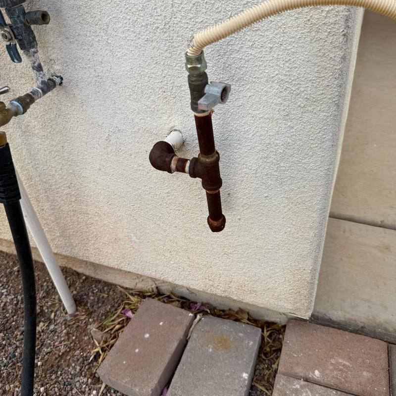 Gas line black iron cap installation on exterior wall
