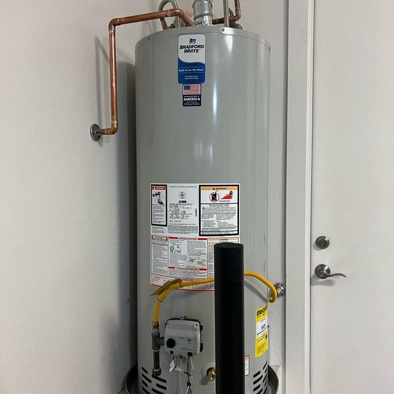 Water heater replacement with new drain pan and piping