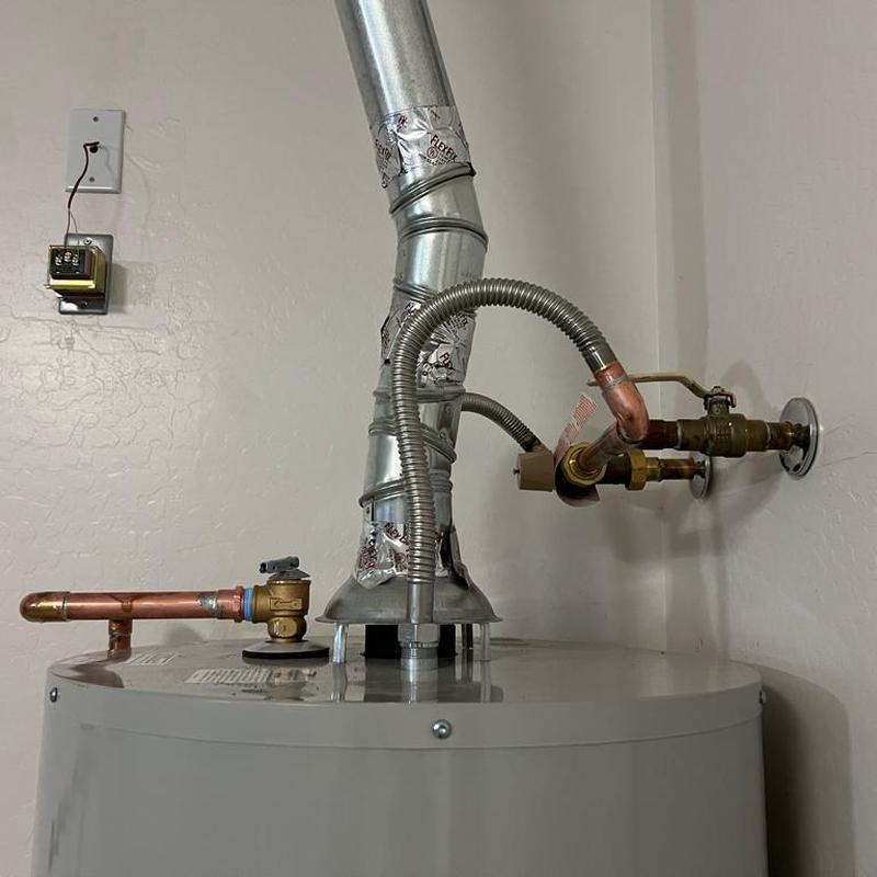 Water heater with new flue vent and flex gas lines installation
