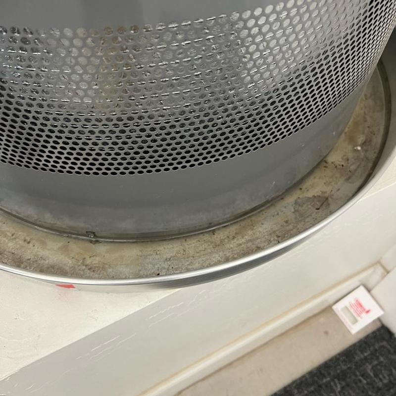 Water heater drain pan with water residue