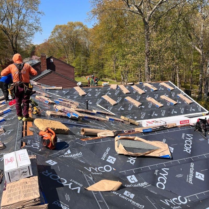 Roof underlayment installation with contractor on site Roof underlayment installation with contractor on site