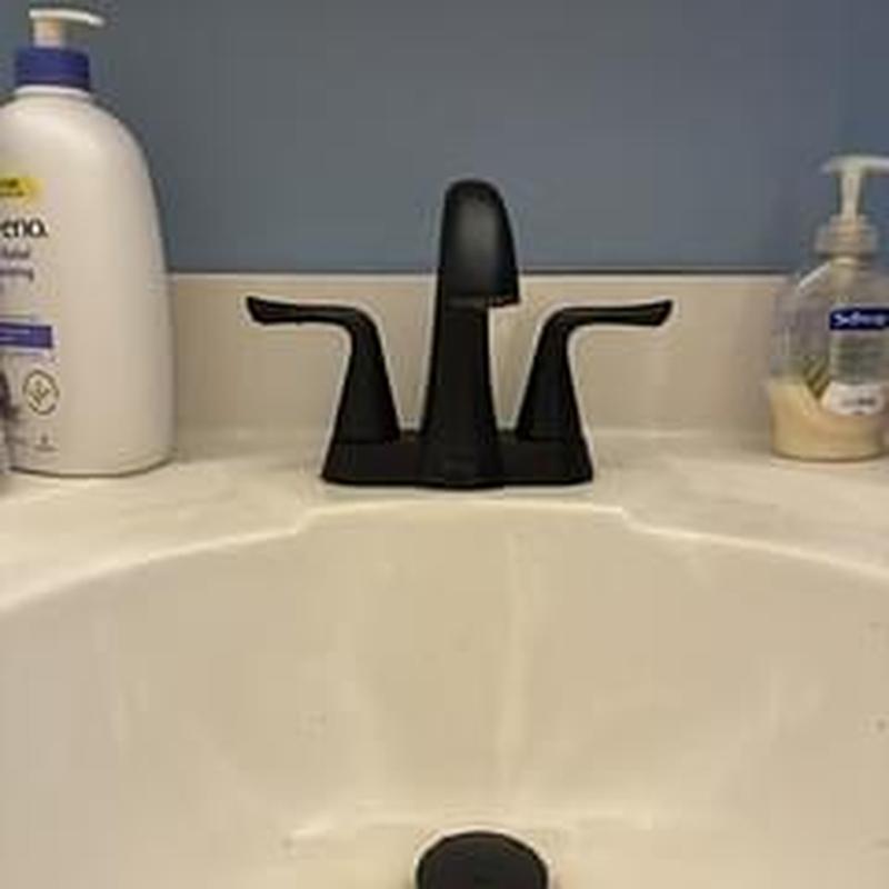 Lavatory faucet with black handles on sink Lavatory faucet with black handles on sink
