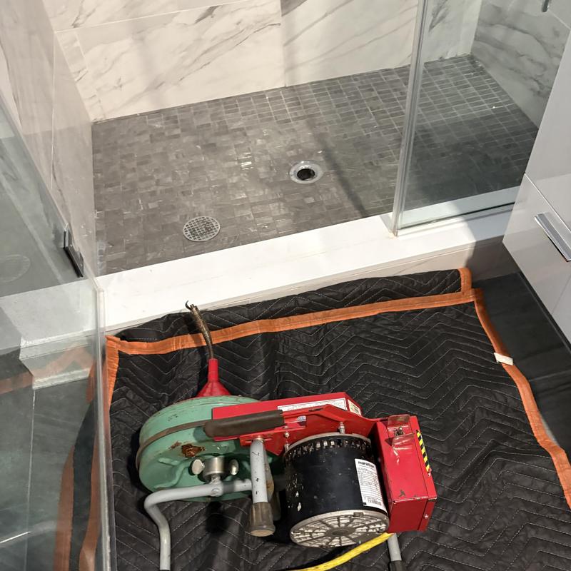 Bathroom secondary drain line with drain cleaning machine Bathroom secondary drain line with drain cleaning machine