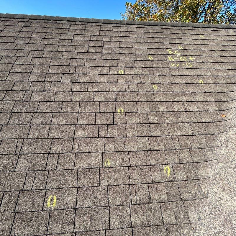Asphalt shingles with hail damage markings