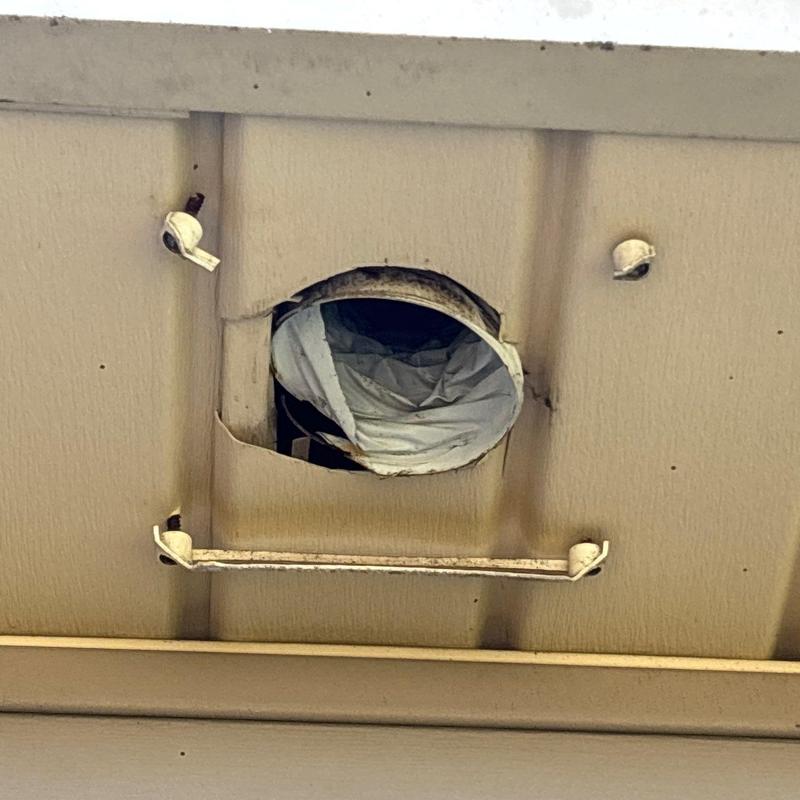 Metal vent duct with damaged insulation wrap