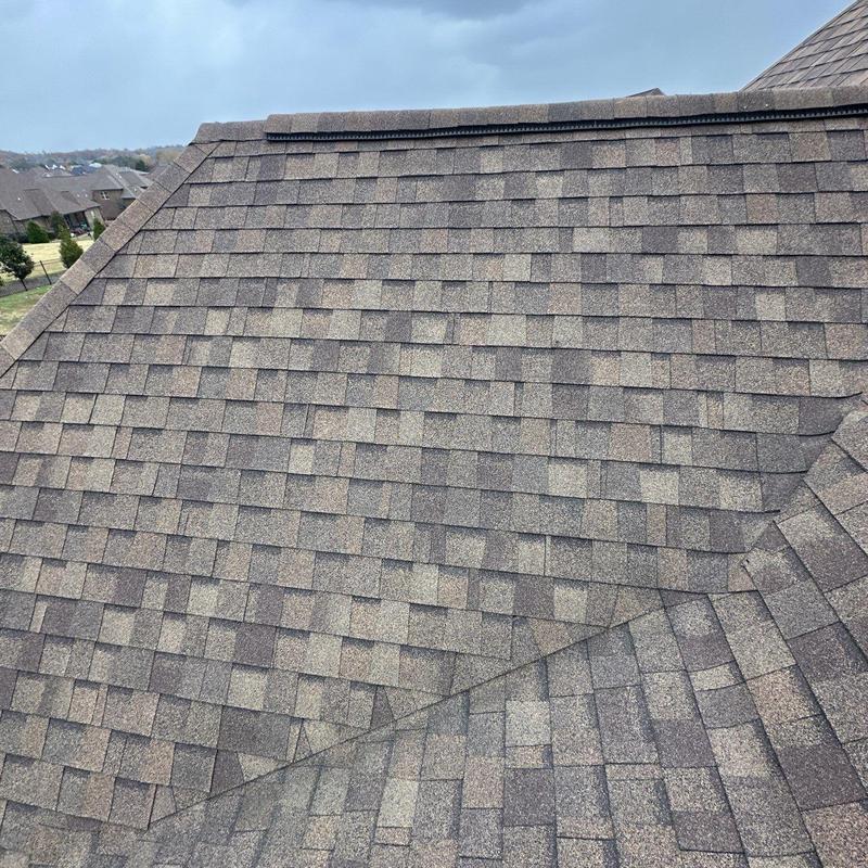 Asphalt shingle roof with hail damage and granule loss