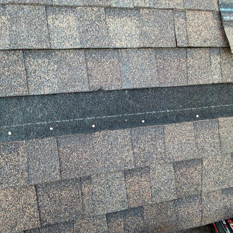 Roof shingle granules showing hail damage and wear