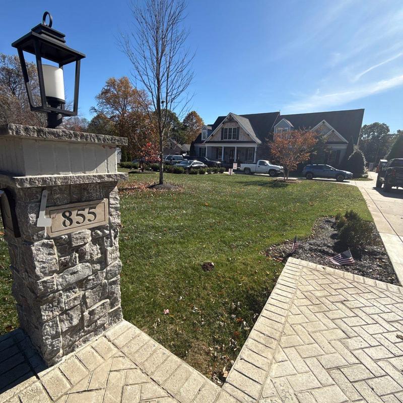 Stone mailbox with light fixture and house number 855
