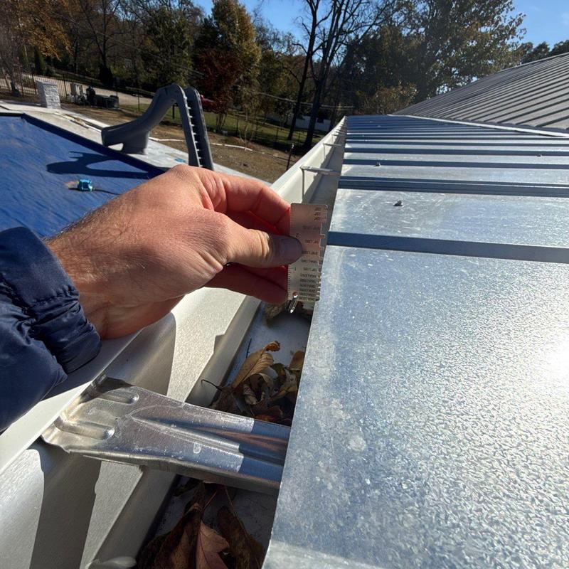Metal roof panel hail damage inspection with measurement