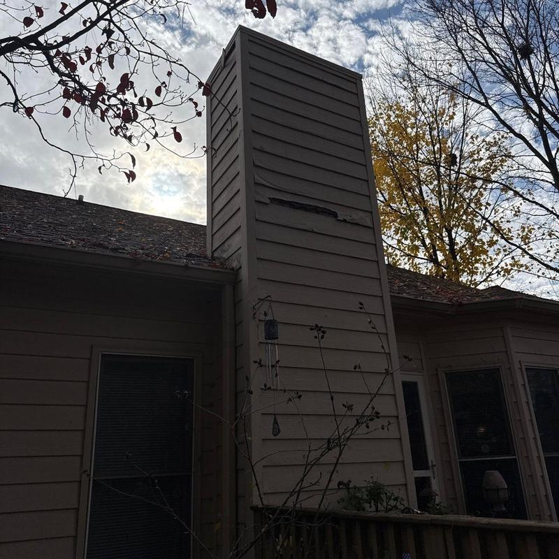 Chimney siding damage and roof shingle hail impact