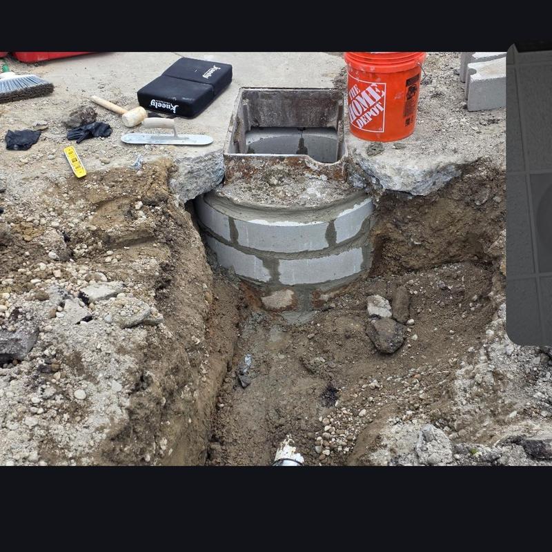 Storm basin rebuild with drainage pipe replacement