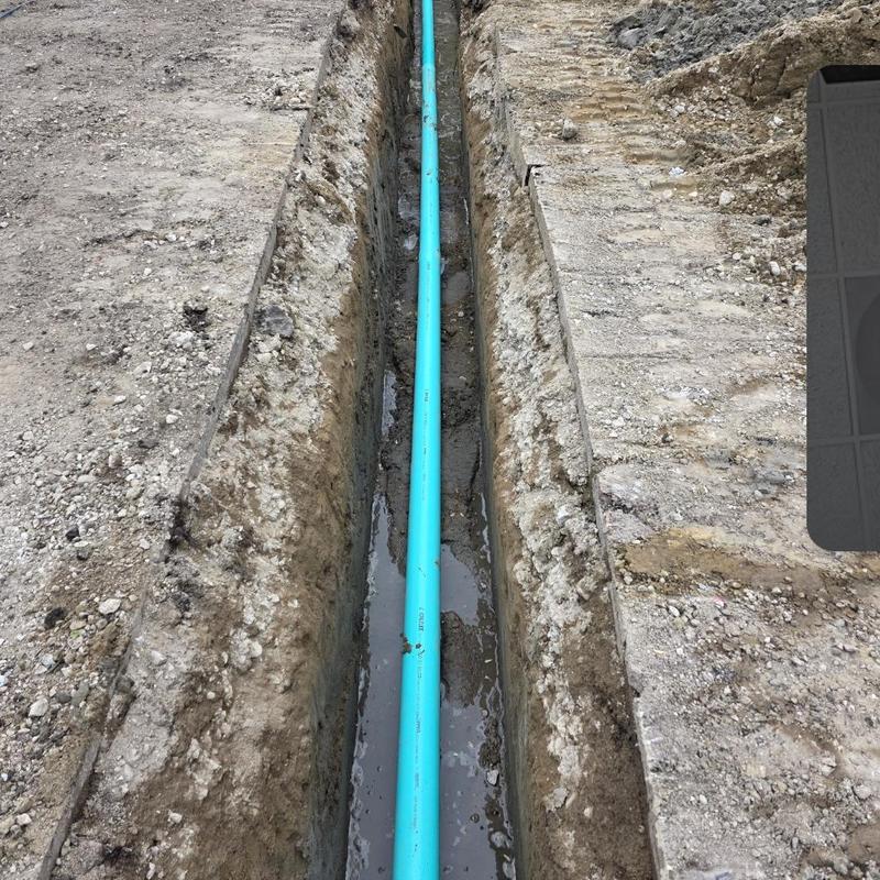 SDR 35 drainage pipe in excavated trench