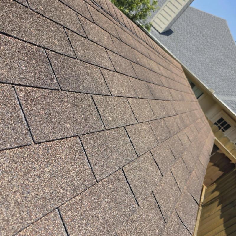 Architectural shingle roof close-up after hail inspection Architectural shingle roof close-up after hail inspection