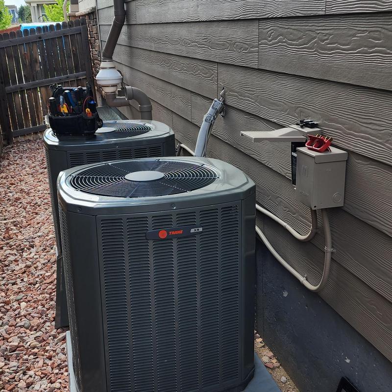 Trane XR AC condensers with technician tools on top