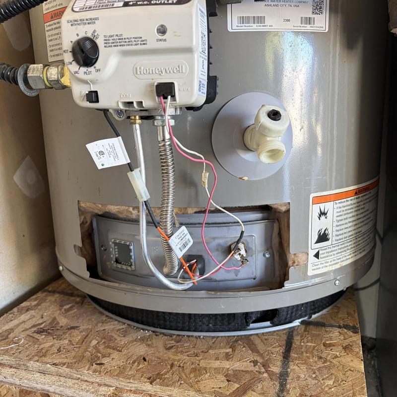 Water heater gas valve and pilot control unit close-up