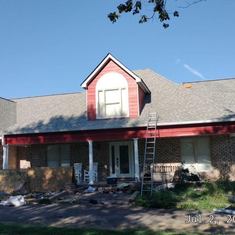 Owens Corning Oakridge asphalt roof with ladder on house Owens Corning Oakridge asphalt roof with ladder on house
