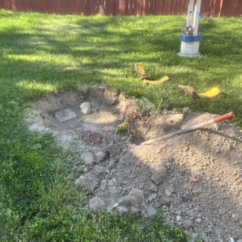 Septic tank inlet excavation and soil removal in yard