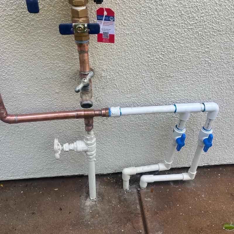 Pressure backflow valve with copper and PVC piping