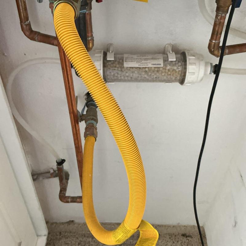 Neutralizer balls and yellow hoses with copper pipes