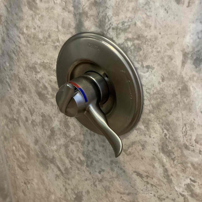 Shower valve handle with temperature indicator on wall