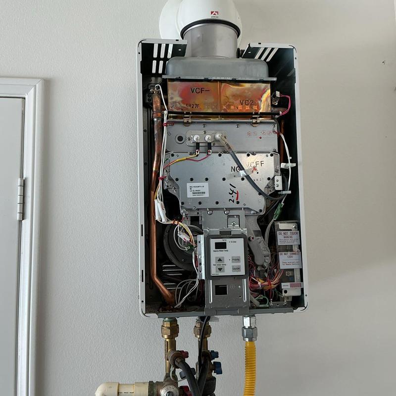 Tankless water heater interior with piping and valves