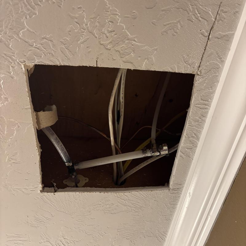 Ice maker water line plumbing inside wall cavity