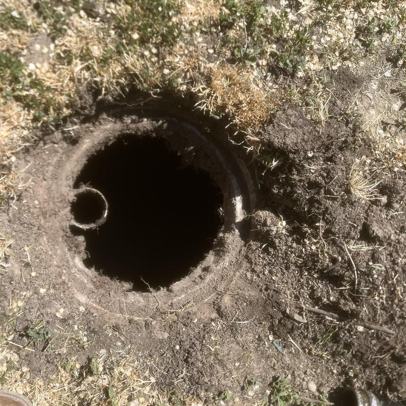 Septic tank opening exposed for pump out and inspection