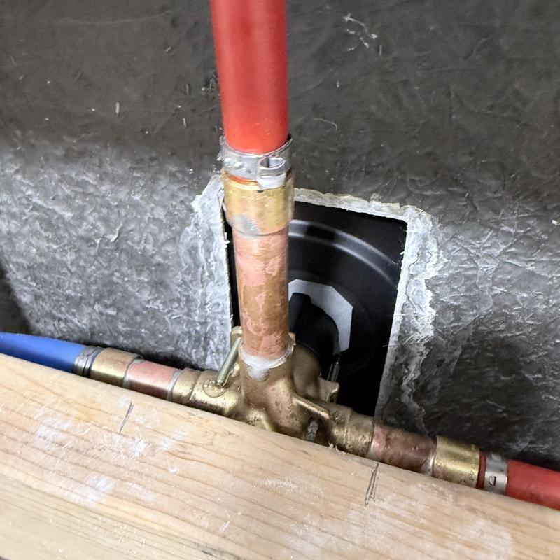 Shower valve with copper piping and wall cutout Shower valve with copper piping and wall cutout