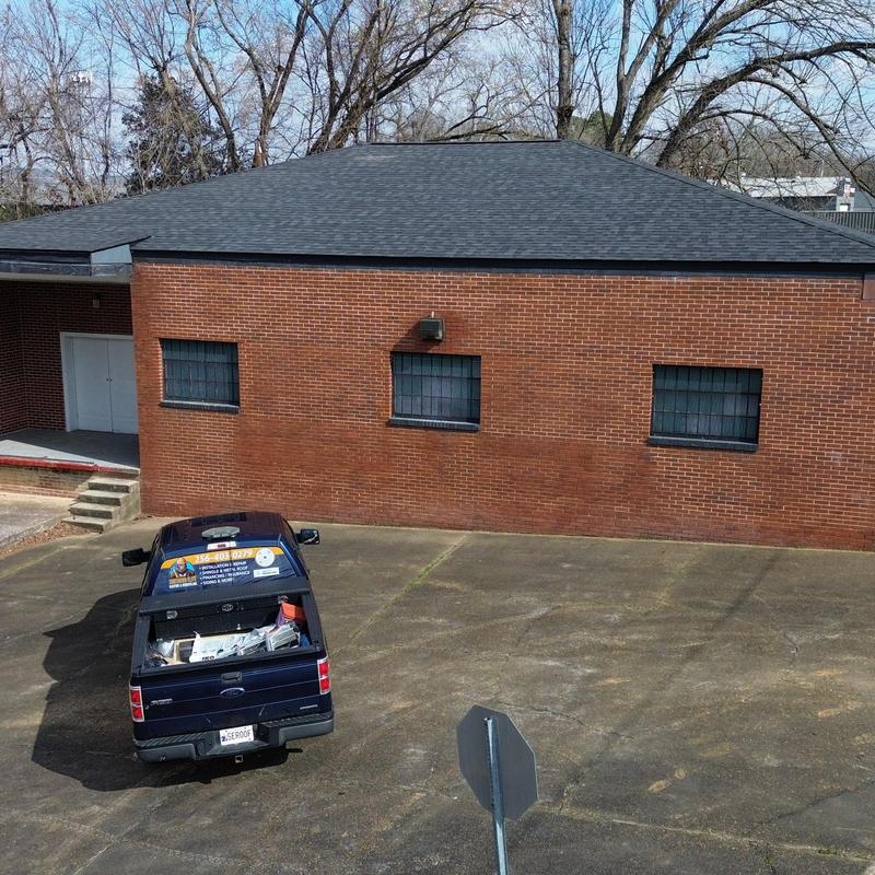 Asphalt shingle roof on commercial brick building