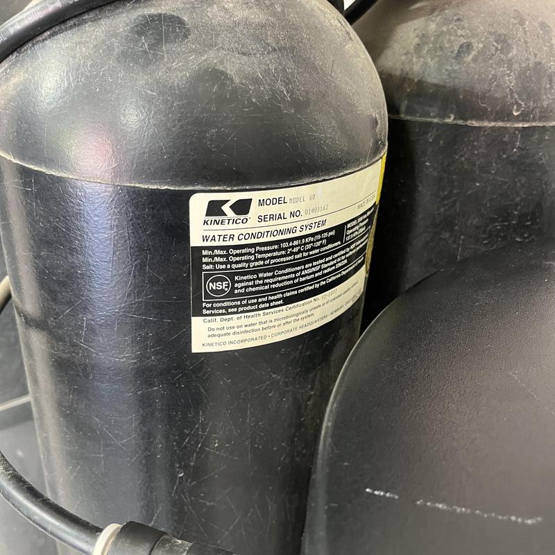 Water softener tank with model and serial label