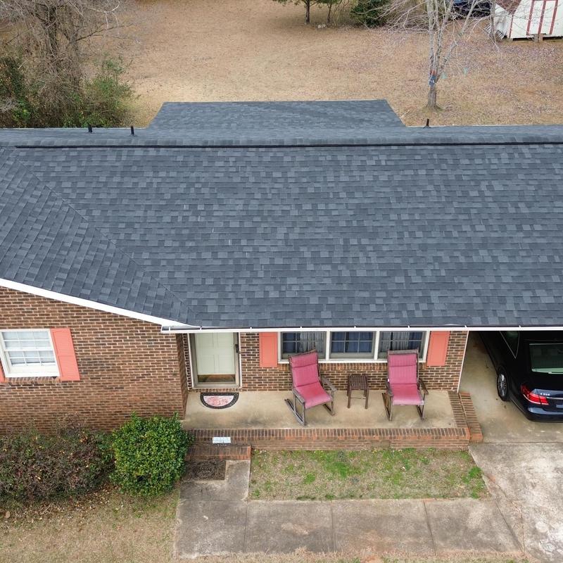 Charcoal shingle roof with porch and driveway Charcoal shingle roof with porch and driveway