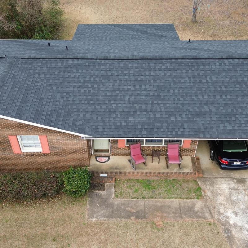 Charcoal shingle roof replacement on brick home Charcoal shingle roof replacement on brick home