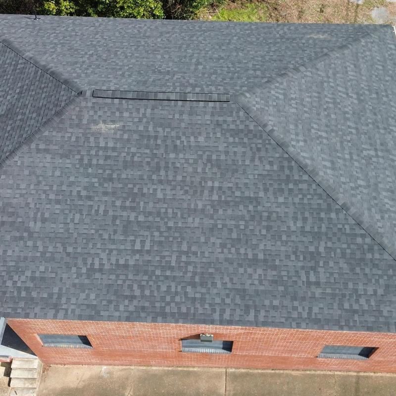 Asphalt shingle roofing with clean ridge lines