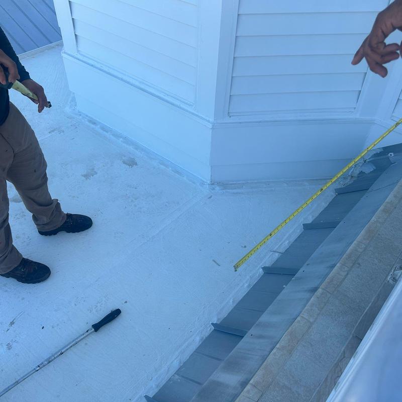 Flat deck roof with new waterproof coating and flashing Flat deck roof with new waterproof coating and flashing