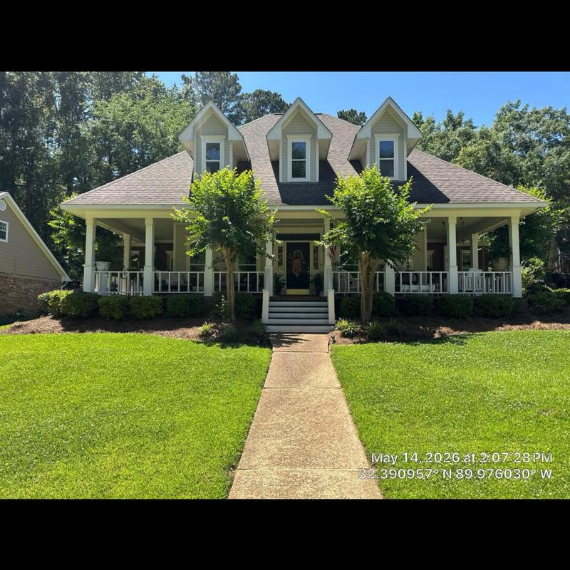 Asphalt shingle roof on residential home with front porch