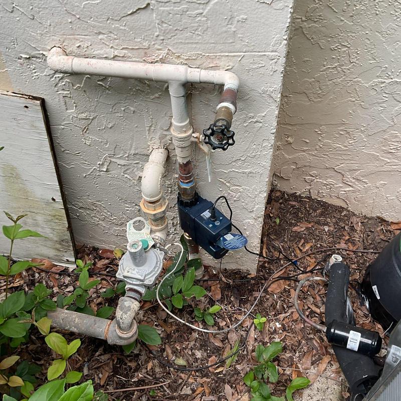 Flo by Moen smart water valve on main pipe outdoors