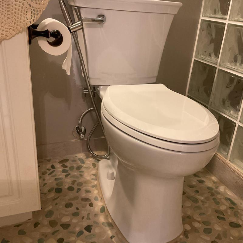 American Standard toilet installation in bathroom corner