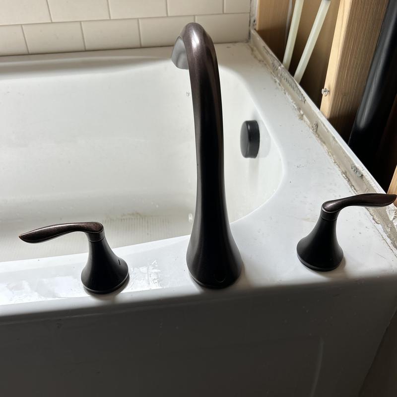 Roman tub faucet with oil-rubbed bronze handles