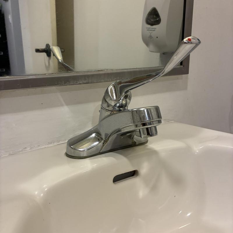 Bathroom sink faucet with lever handle installed Bathroom sink faucet with lever handle installed
