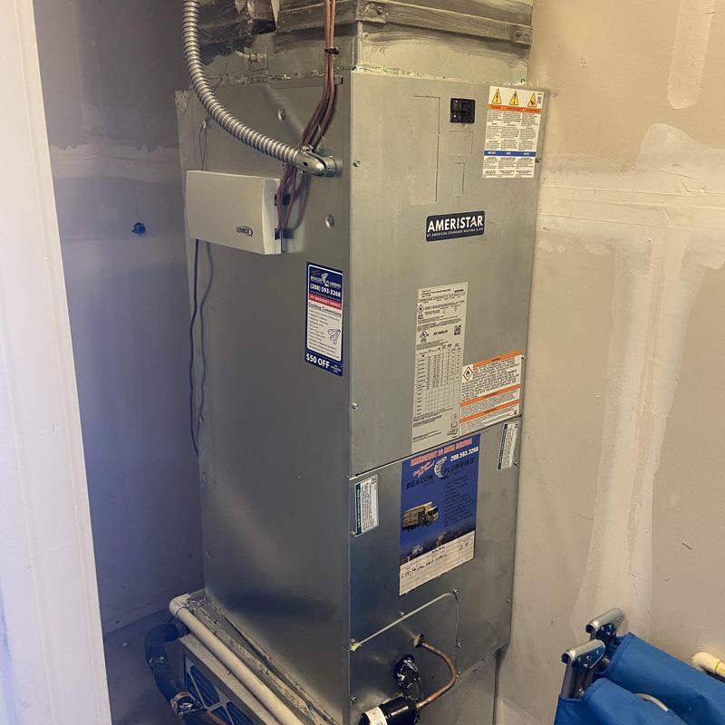Air handler unit with heat strip installed in utility closet