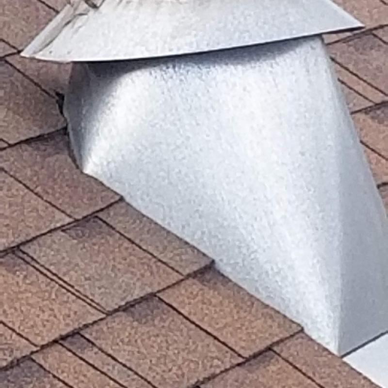 Chimney cap and CertainTeed Landmark Pro shingles on roof