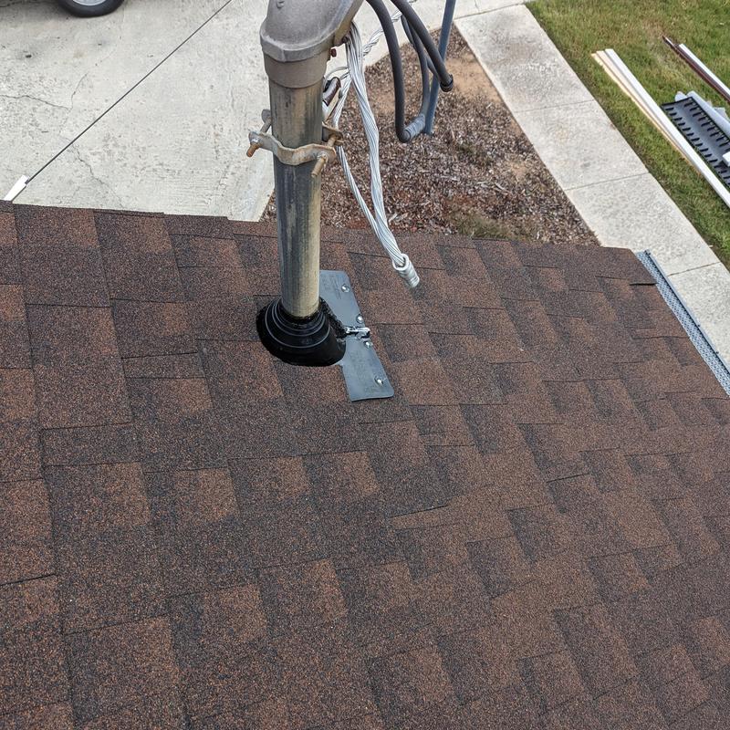 Asphalt shingle roof with vent pipe flashing installation