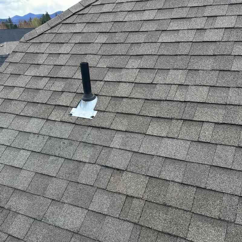Roof shingles with vent pipe flashing installation