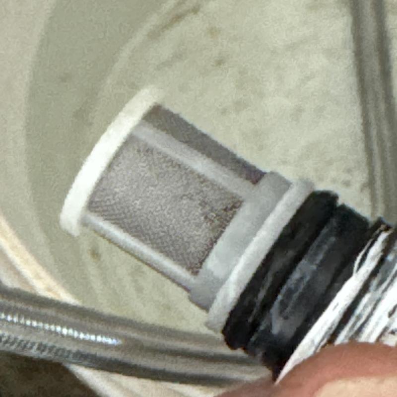 Tankless water heater filter screen removal close-up Tankless water heater filter screen removal close-up