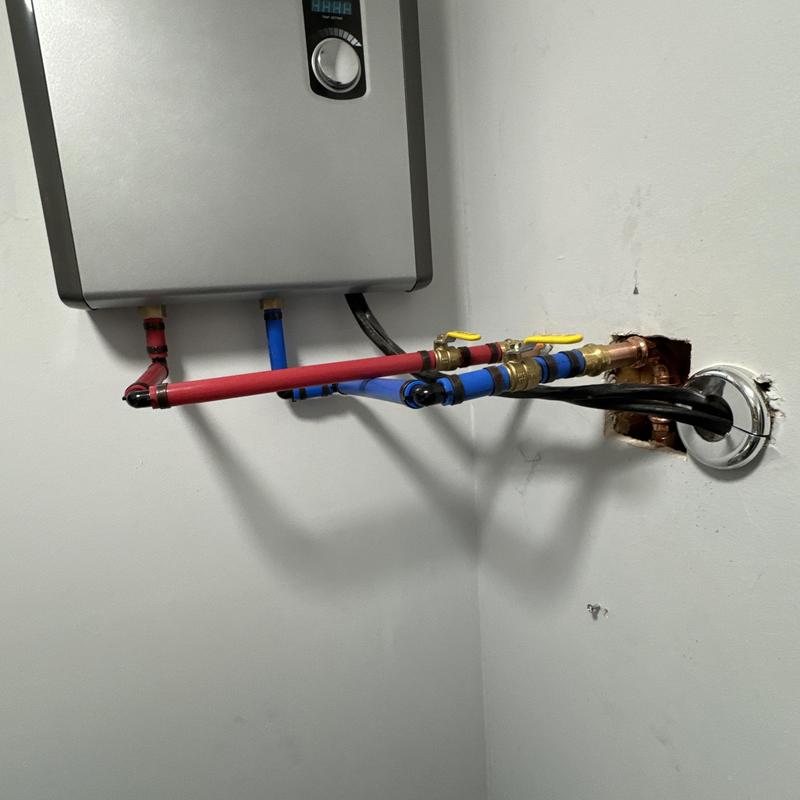 Electric tankless water heater repiping with valves