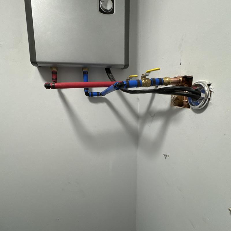 Electric tankless water heater repiping with valves
