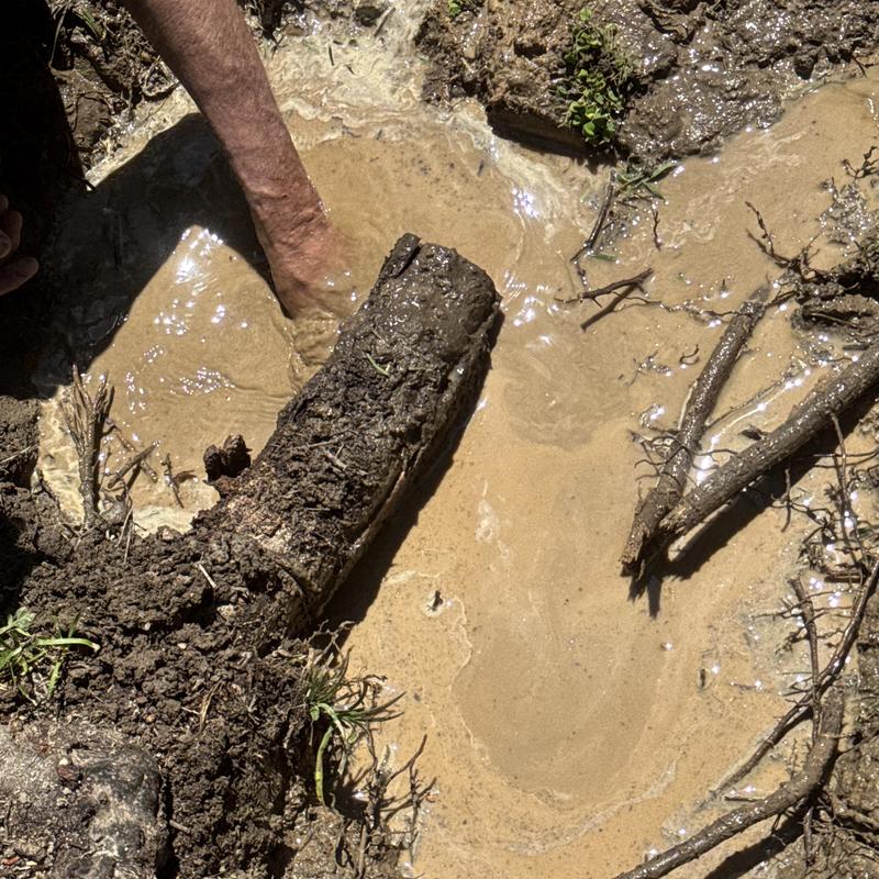 Copper main waterline leak with muddy water and soil Copper main waterline leak with muddy water and soil