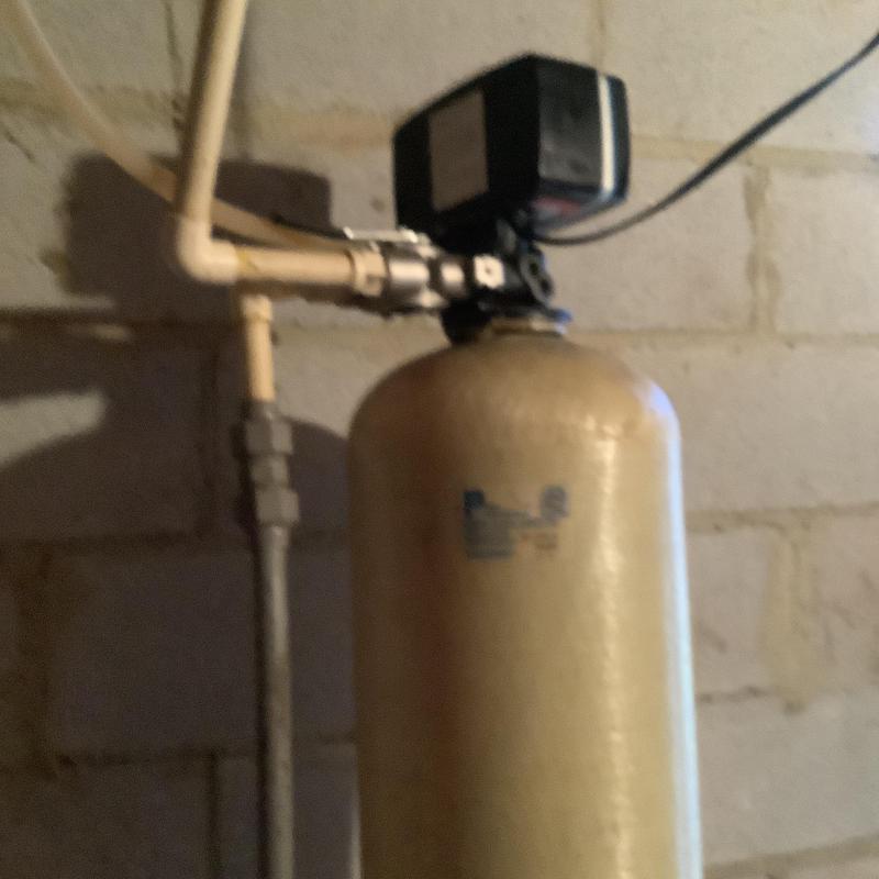 Water softener system with control valve in basement Water softener system with control valve in basement