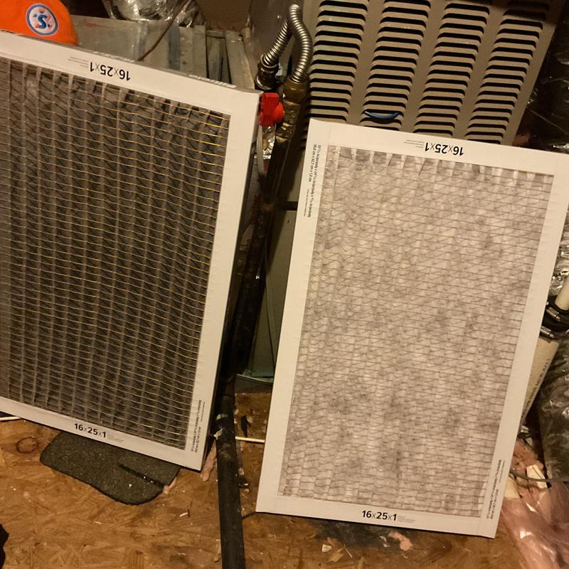 Air conditioner filters positioned near HVAC unit interior Air conditioner filters positioned near HVAC unit interior